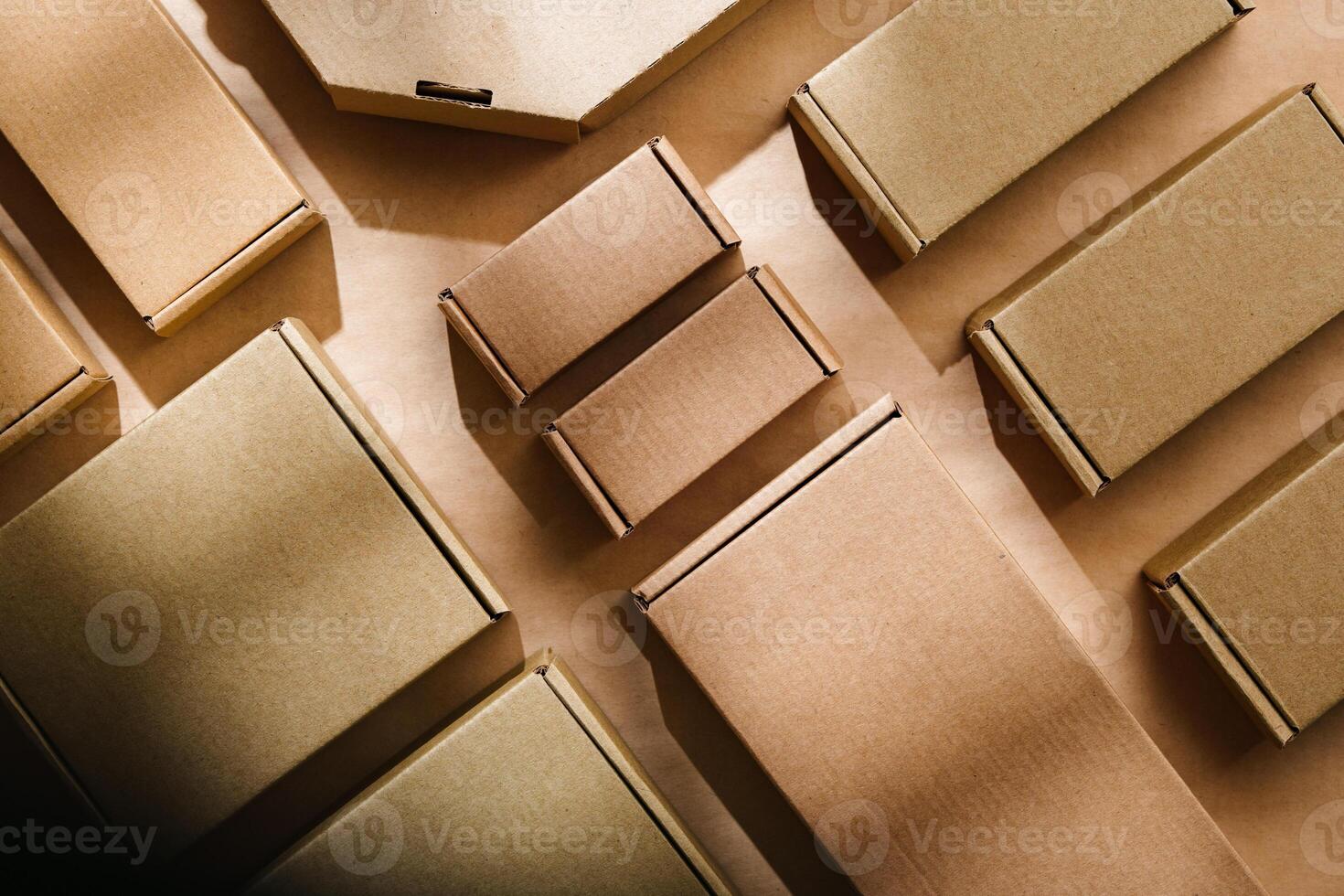 Multiple cardboard boxes arranged on a surface for packaging and shipping in a warehouse setting photo