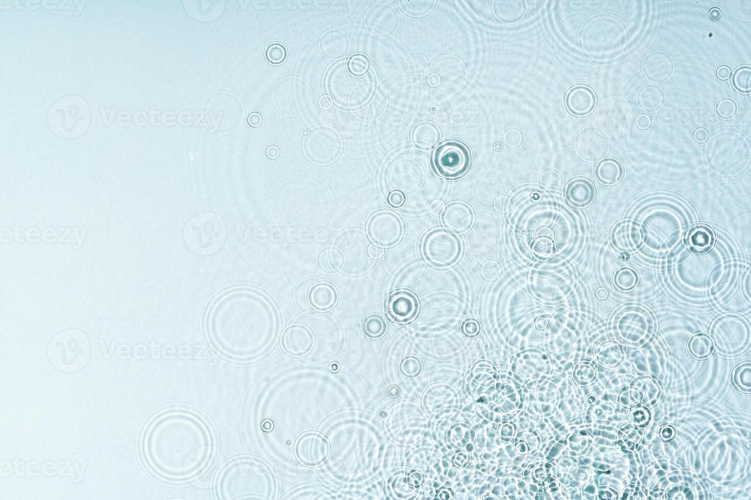 Gentle ripples form on a serene blue surface photo
