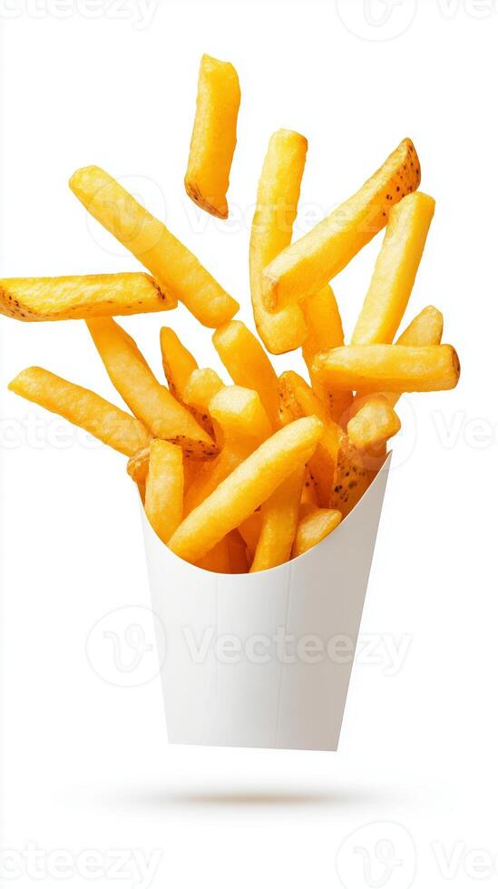 Delicious golden fries tumbling out of a white paper container in a lively display, capturing the essence of fast food indulgence photo