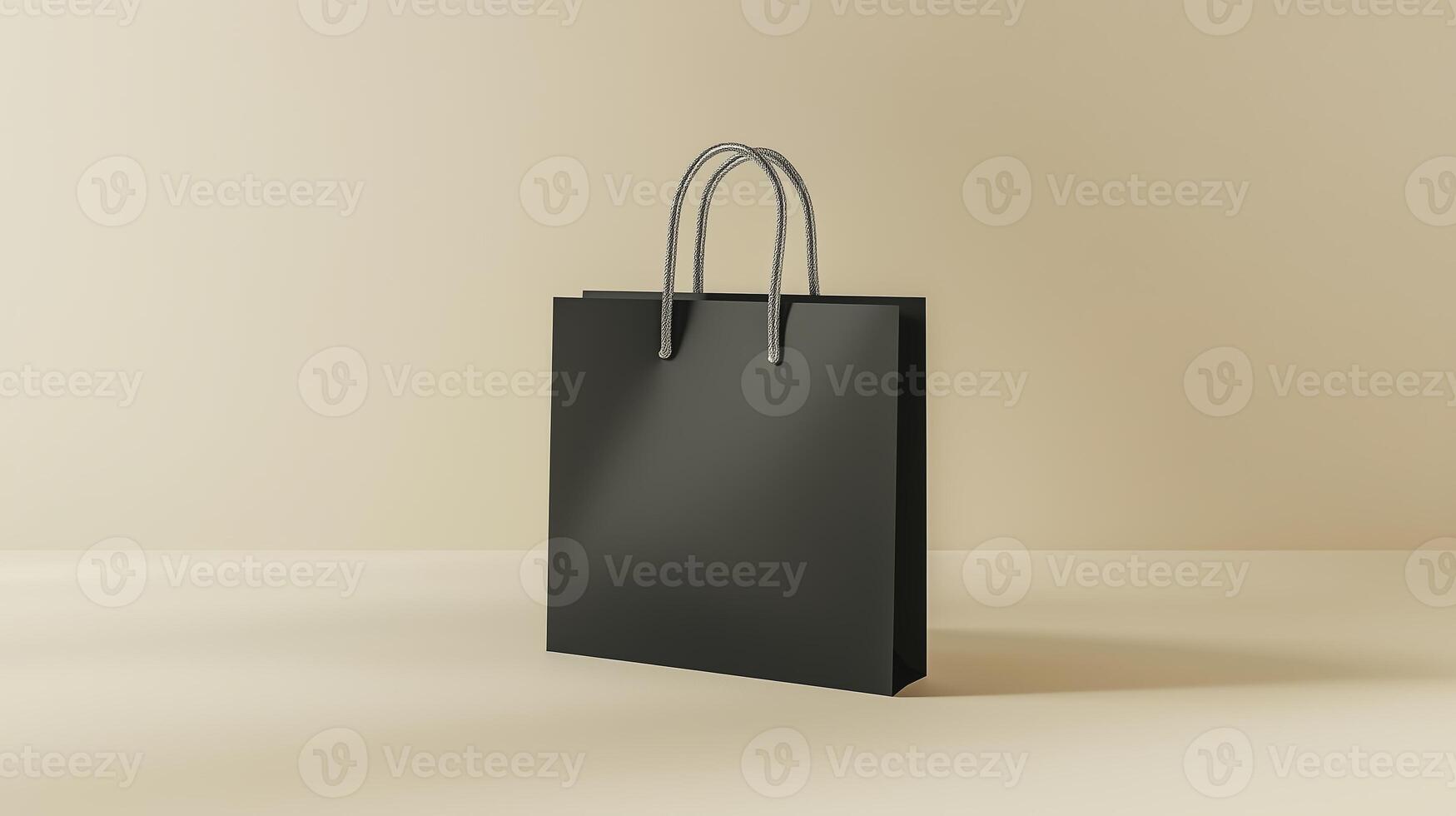 A minimalist black shopping bag displayed on a beige surface in a well-lit indoor setting photo