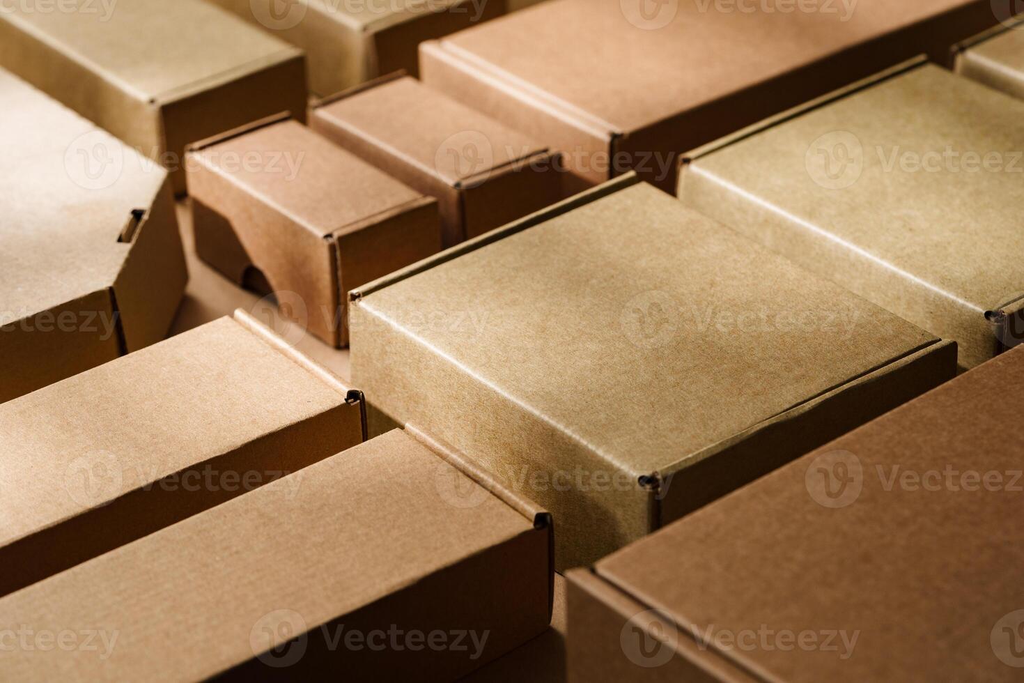 Multiple cardboard boxes arranged on a surface for packaging and shipping in a warehouse setting photo