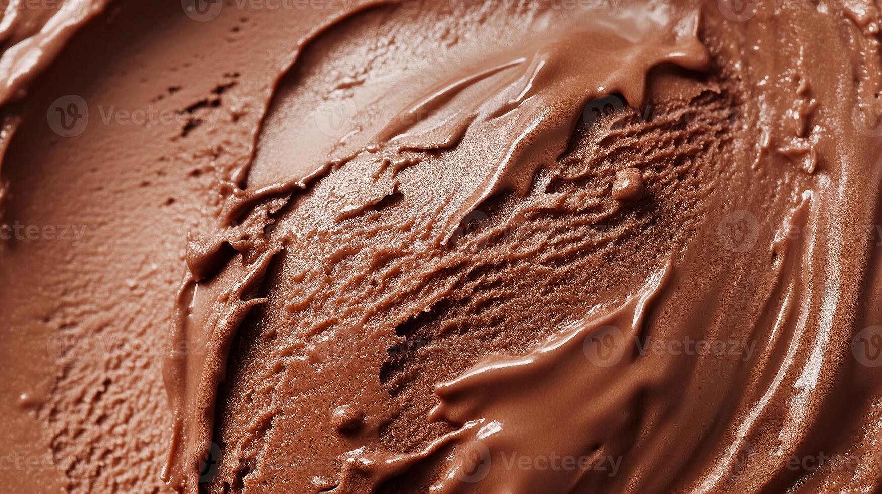 Smooth, creamy chocolate spread being spread on a surface, showcasing rich texture and deep color in a close-up view photo