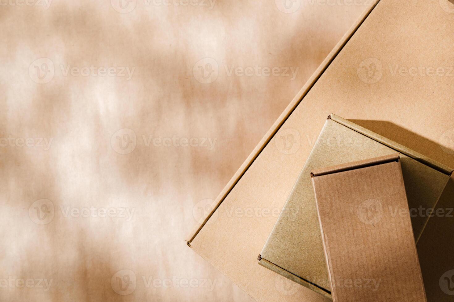 Stacked cardboard boxes on a neutral background in a shipping or packaging setting photo