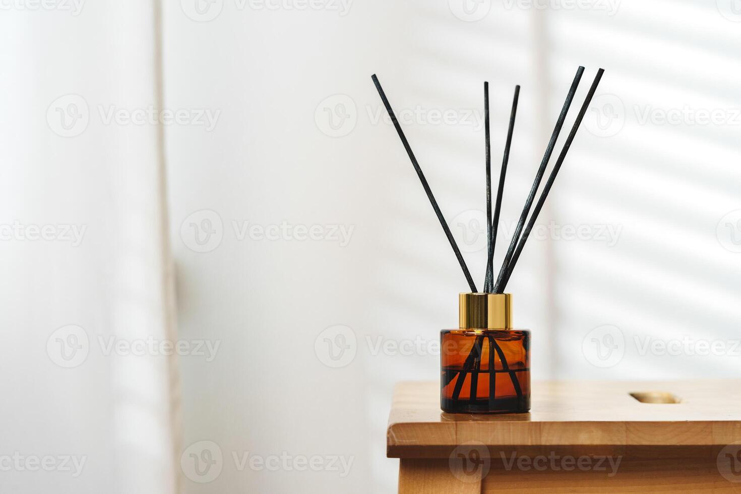 Elegant Reed Diffusers on Wooden Surface With Soft Background Light photo