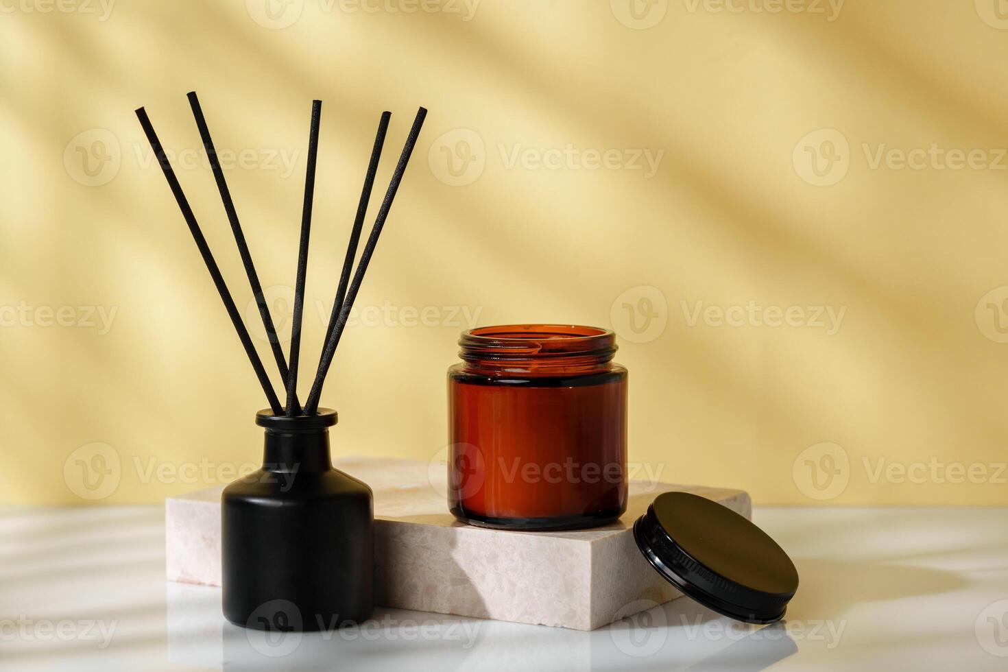 Elegant Reed Diffuser and Scented Candle on a Modern Desk at Golden Hour photo