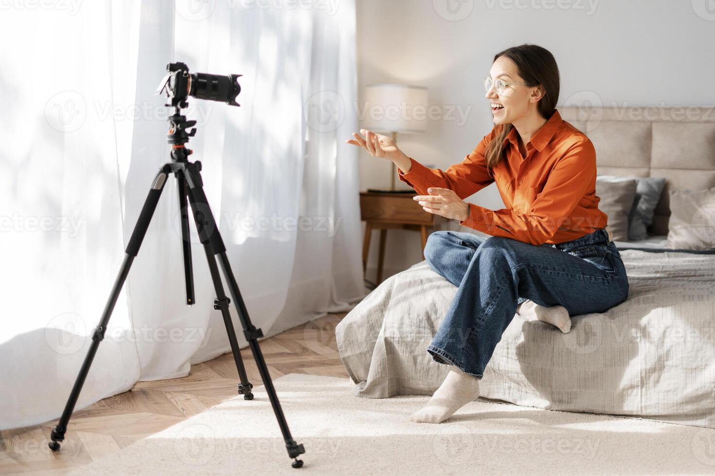 Positive happy student girl talking on call, looking at camera, smiling, laughing photo