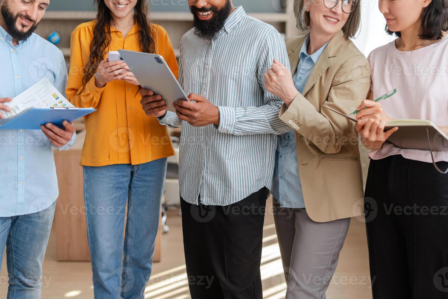 Diverse business team collaborating and discussing a project photo