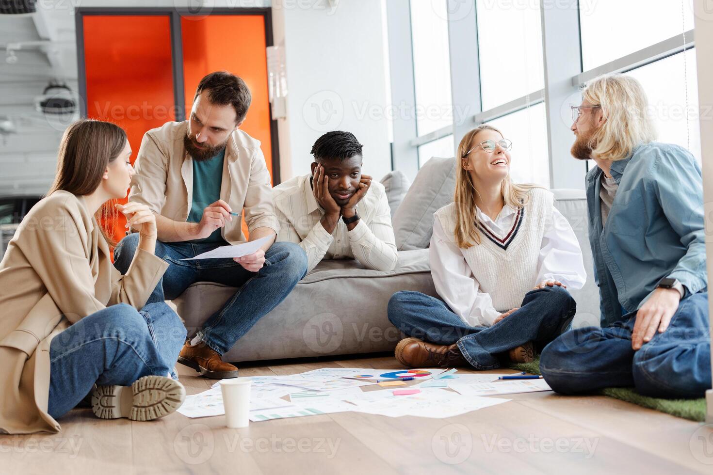 Group of young creative people brainstorming during meeting in office photo