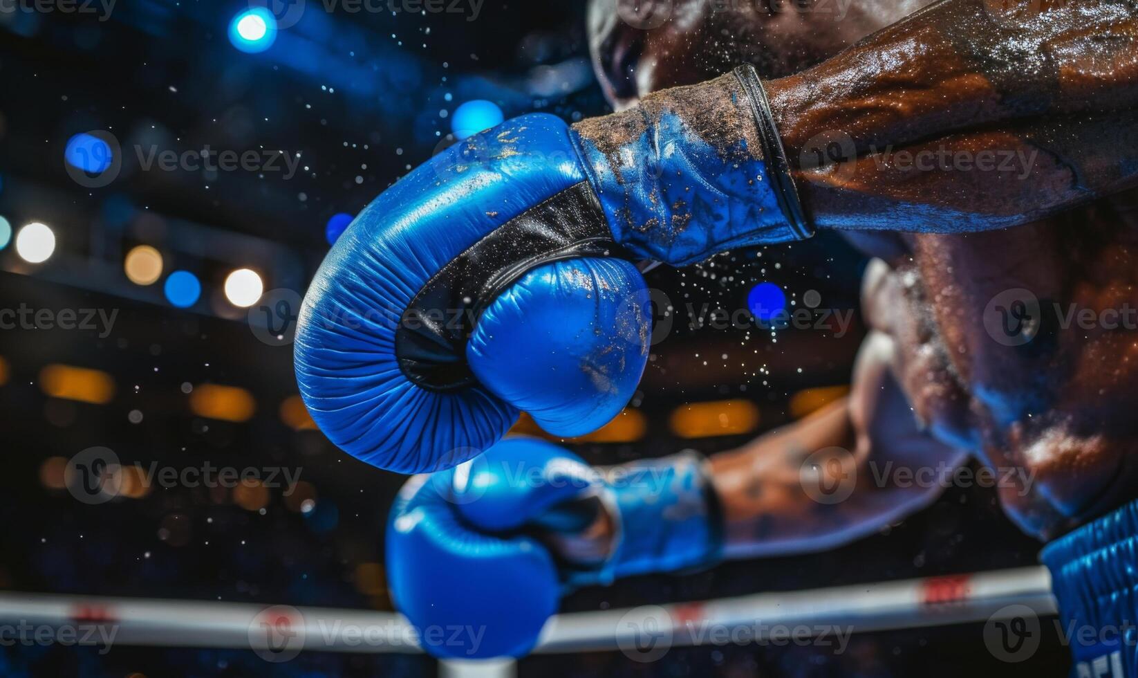 A boxer's gloved hands and body in a fighting stance, with a boxing ring in the background photo