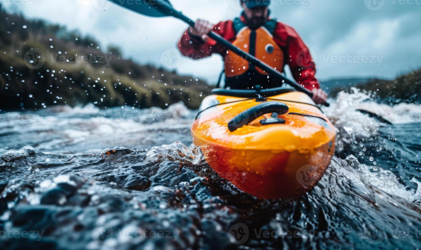 A kayaker's body and paddle in motion on a rapid river, with the surrounding landscape photo