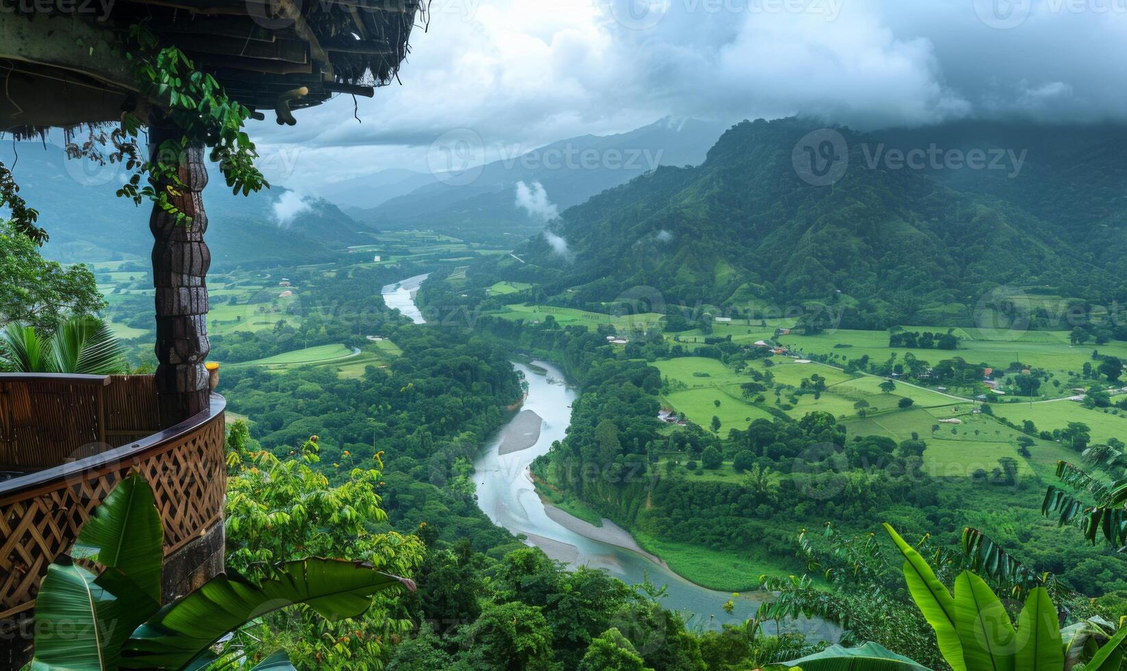 A panoramic view of a winding river through a lush valley, seen from a balcony of a highland retreat photo