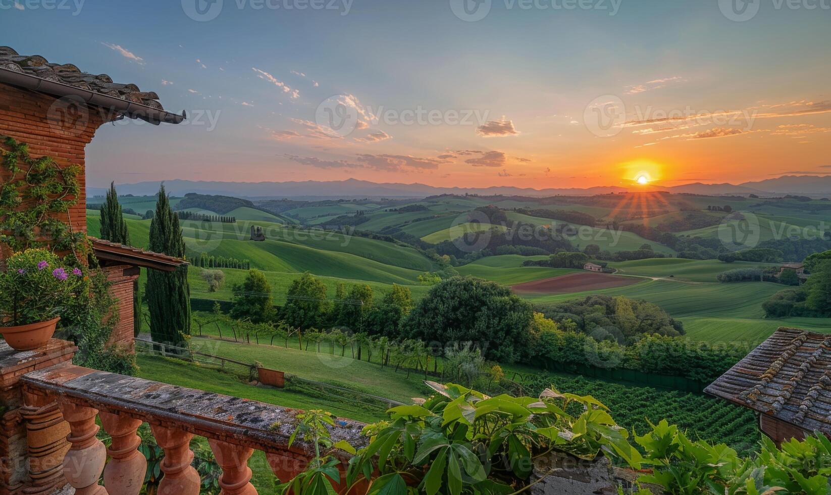 A panoramic view of rolling green hills and farmland at sunset, seen from a balcony of a rural farmhouse photo