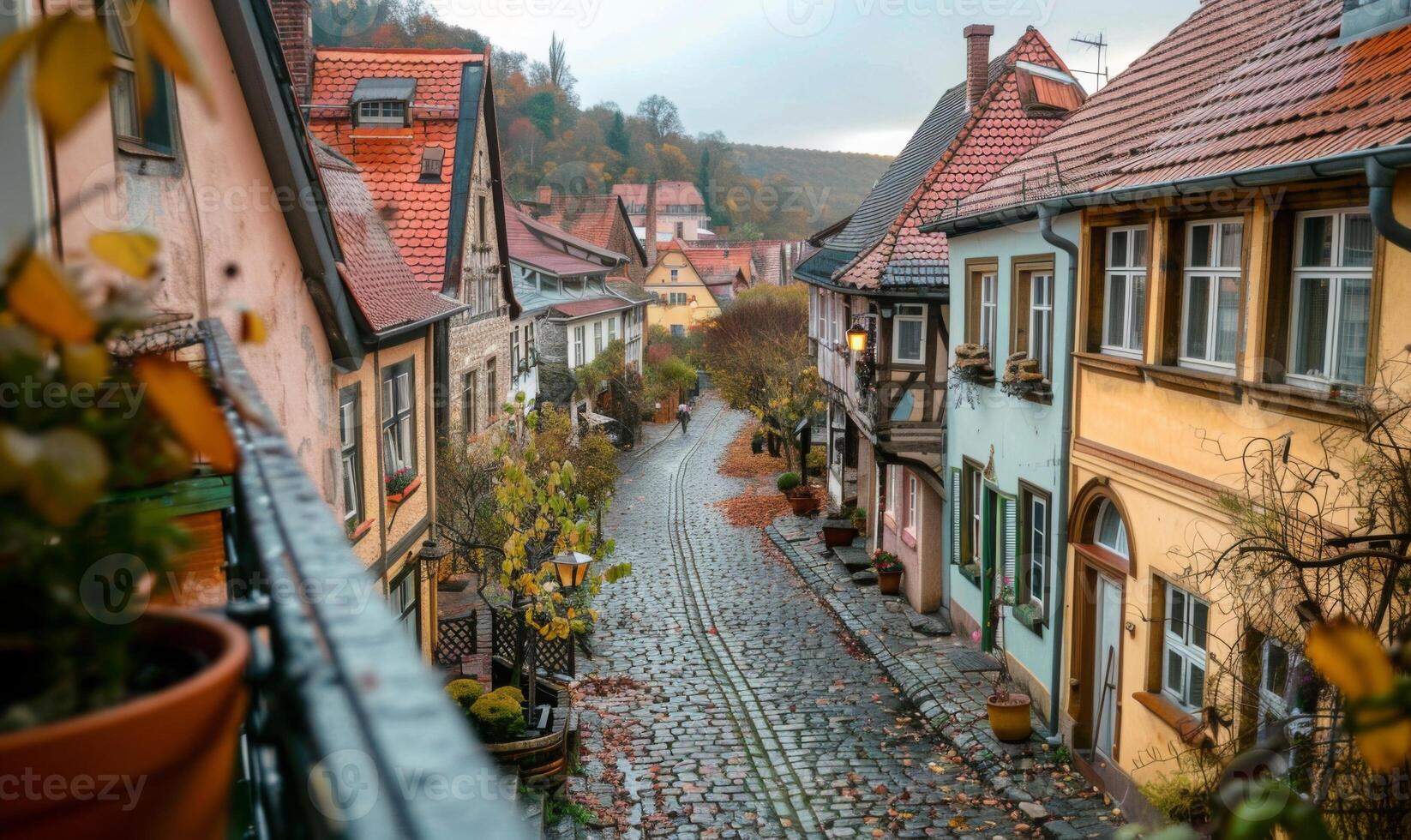 A quaint village with cobblestone streets and historic buildings, viewed from a balcony of a charming inn photo