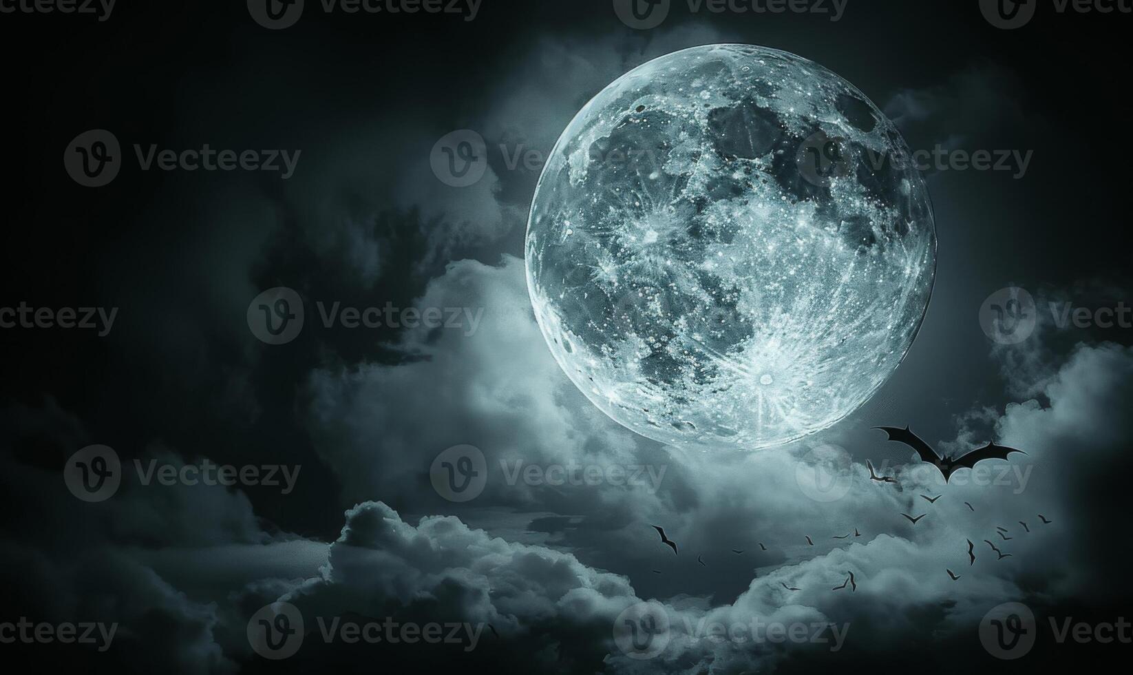 A full moon with eerie clouds and flying bats, with open space at the bottom for text photo