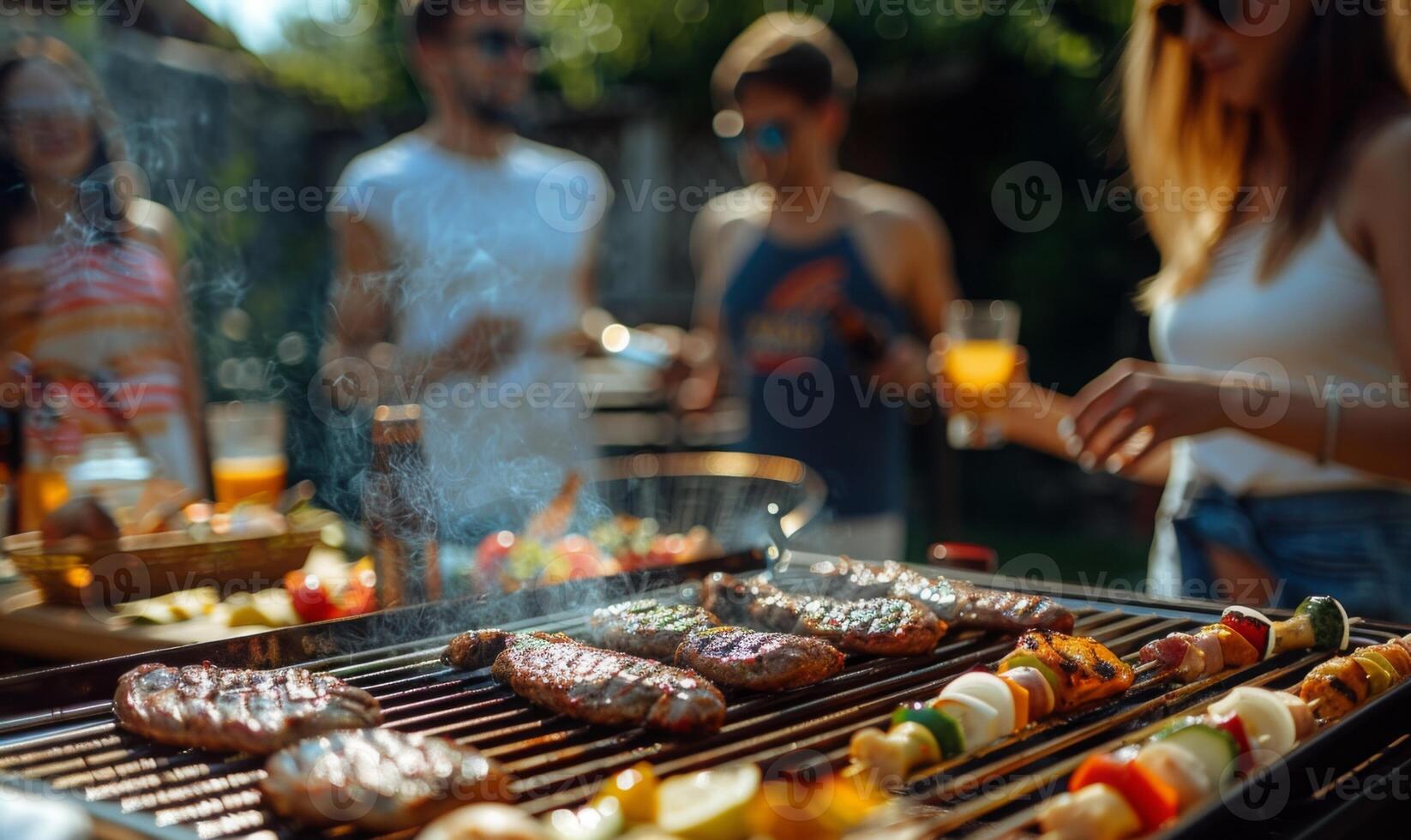 A group of friends enjoying a barbecue in a backyard photo