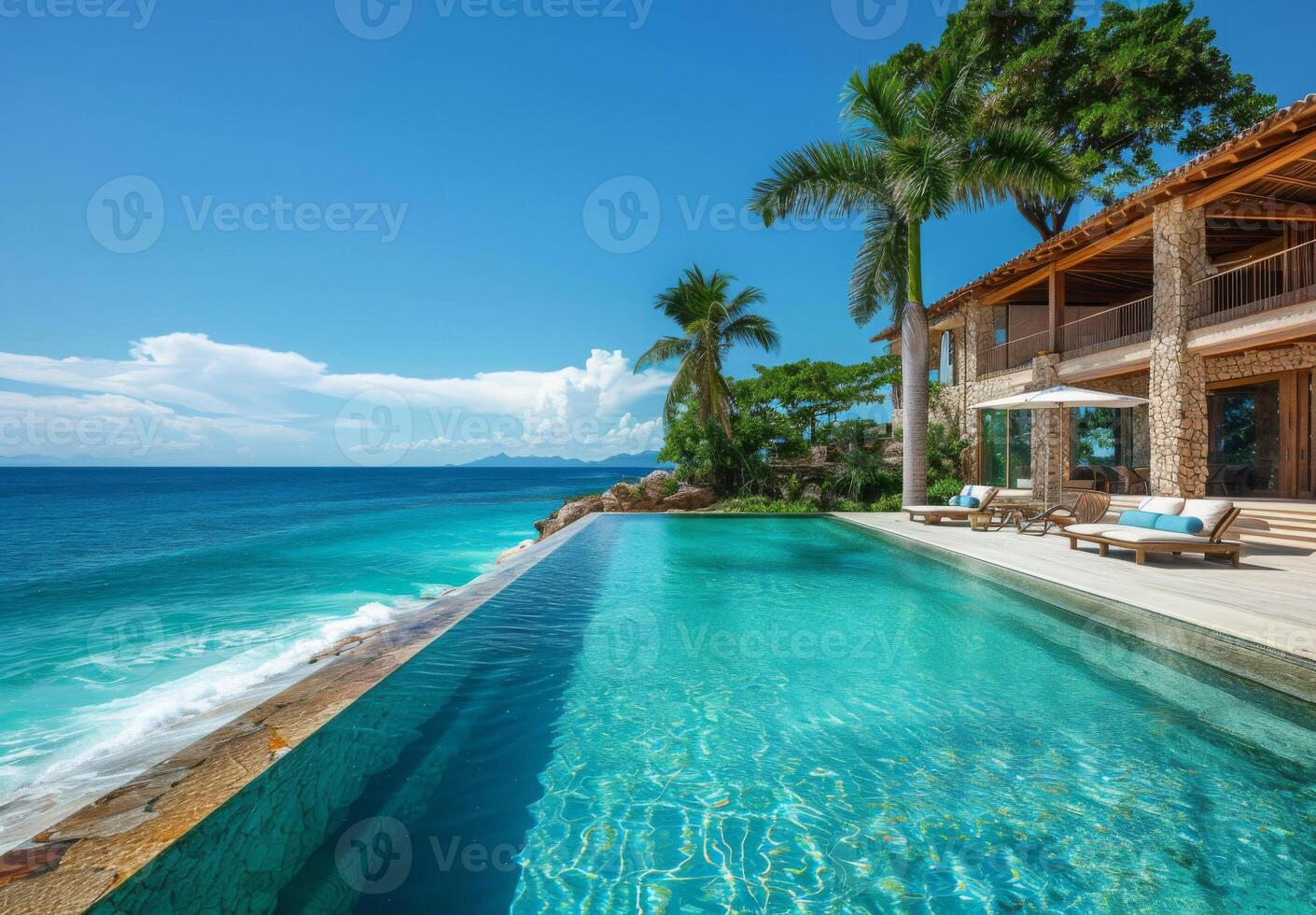 A luxurious beachfront infinity pool blending seamlessly with the ocean horizon photo