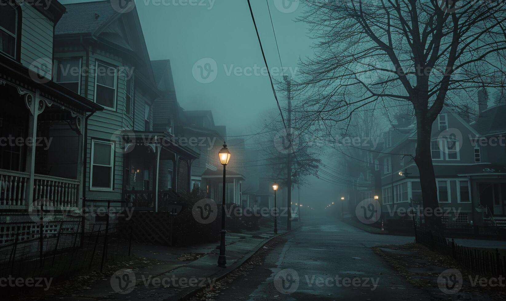A sinister foggy street with old Victorian houses and a lone streetlamp, with open space on the left for text photo