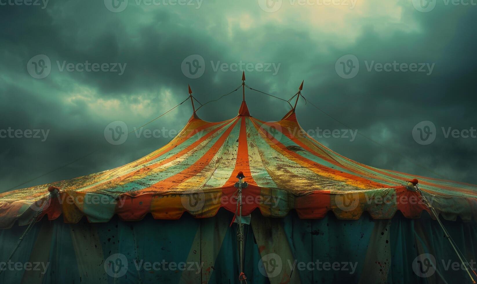 A spooky carnival tent with faded colors and eerie shadows, leaving space at the top for copy photo