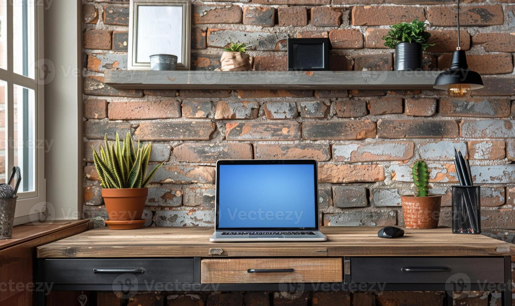 A stylish home office setup with a blank screen laptop and modern decor photo