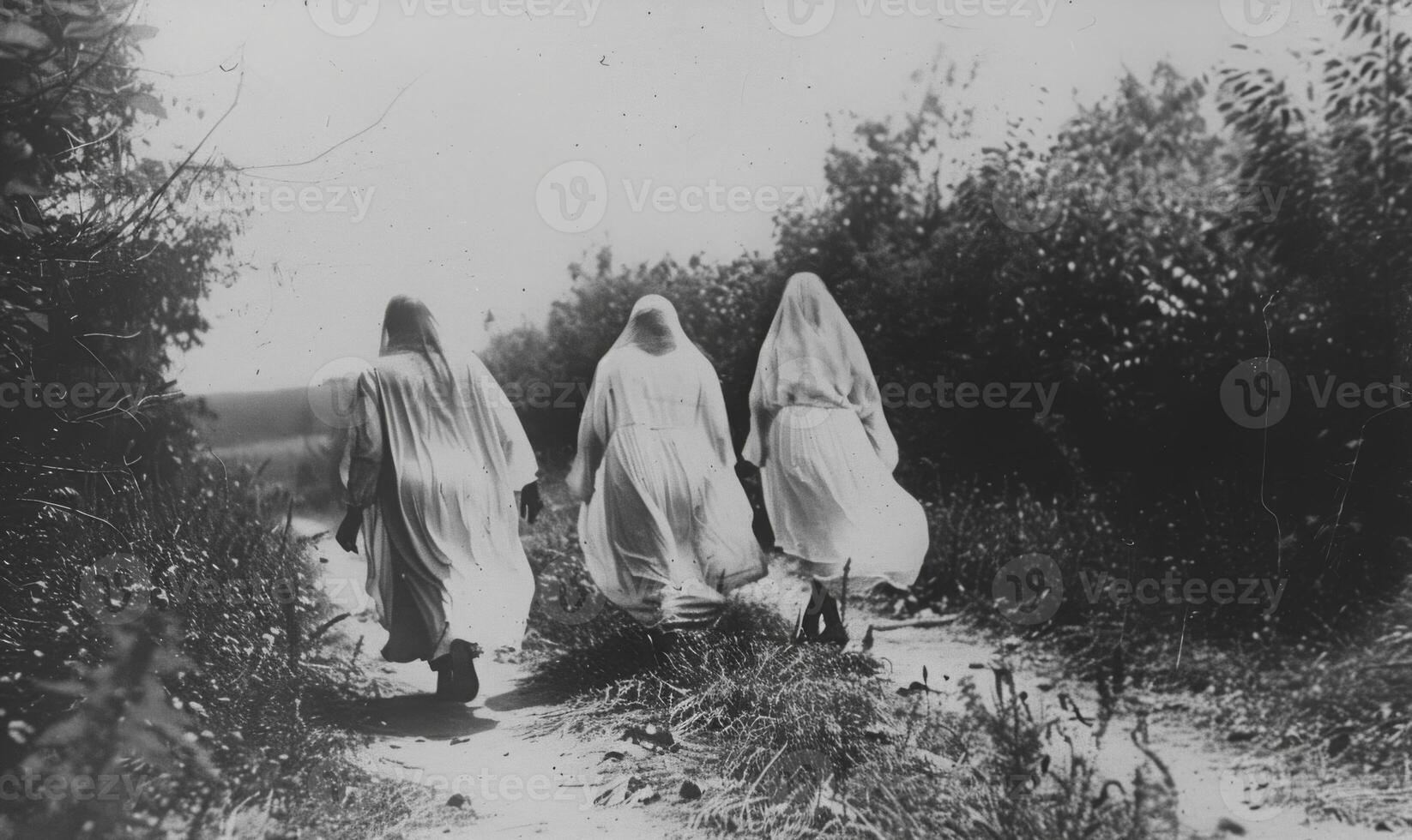 A vintage black-and-white Halloween photo with ghostly figures, leaving plenty of space on the right for a message
