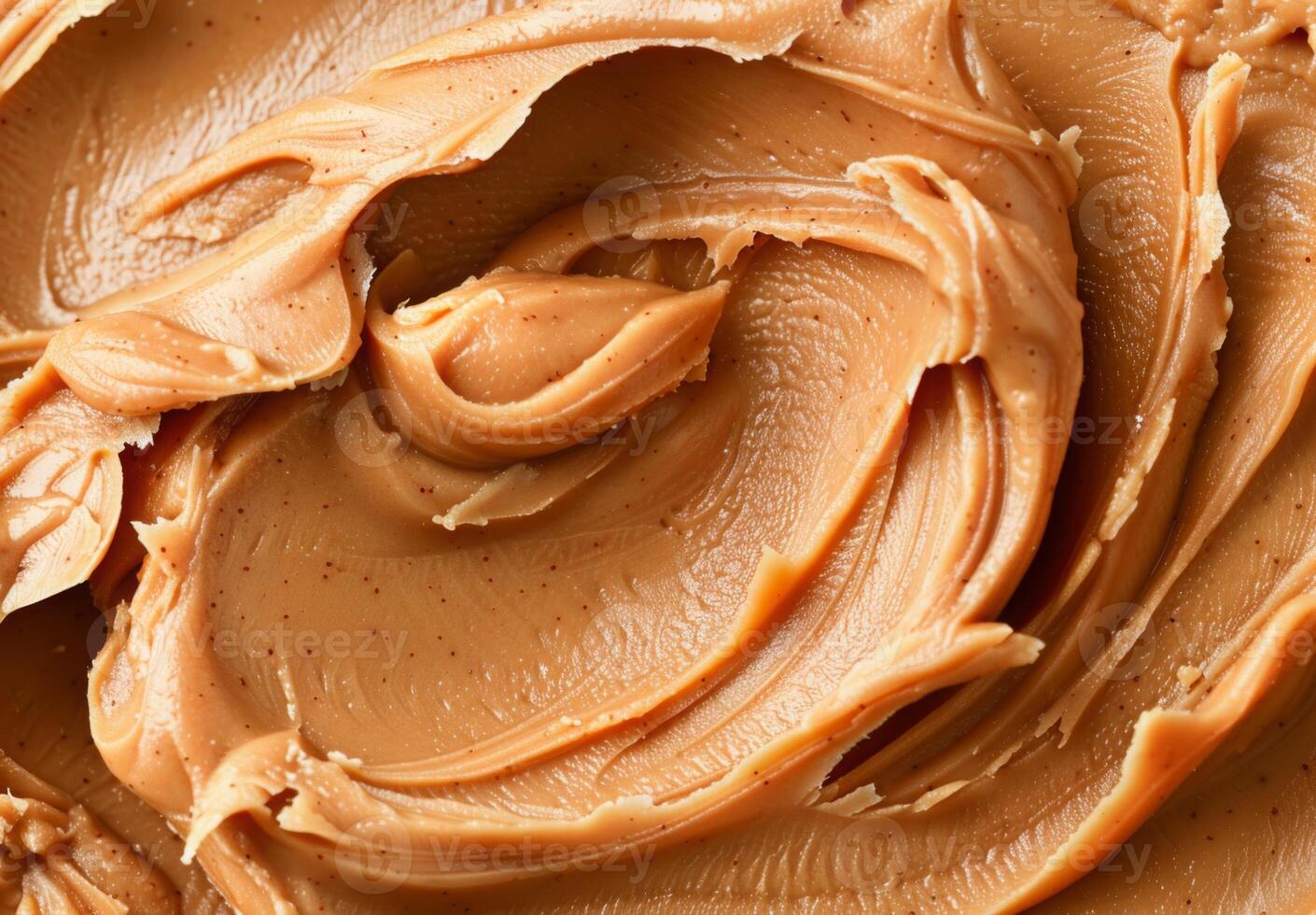 High-detail close-up of the smooth and creamy texture of peanut butter photo