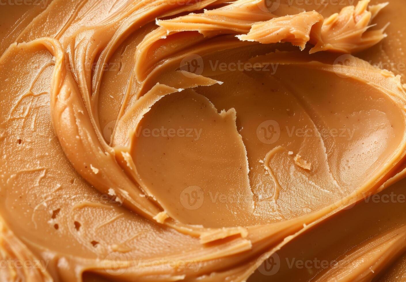 High-detail close-up of the smooth and creamy texture of peanut butter photo