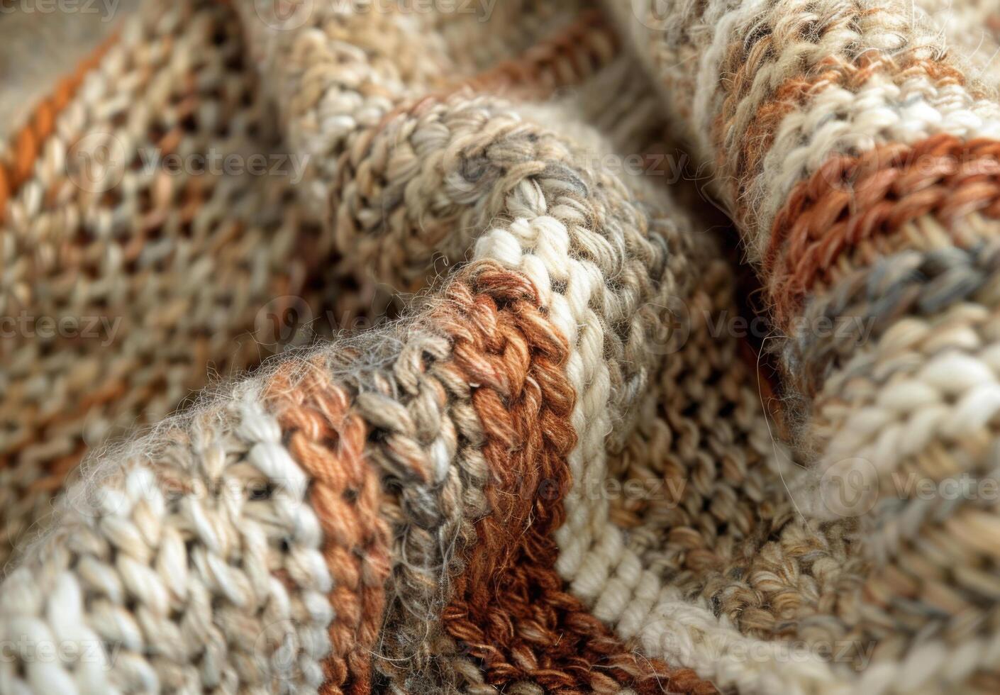 A close up of a knitted wool blanket, revealing the complex stitching and fiber details photo