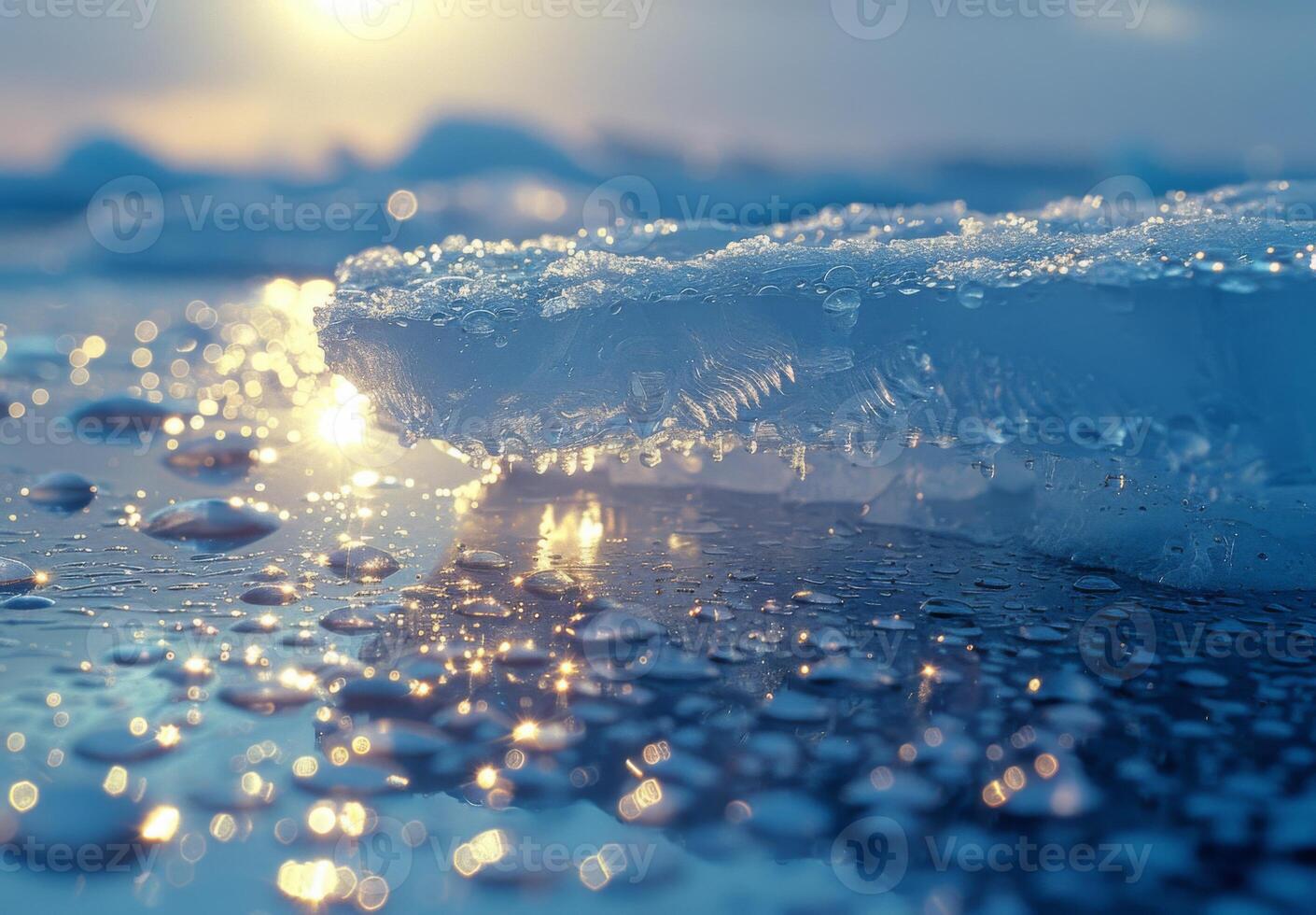 A close up of a melting iceberg with sunlight reflecting off the water droplets photo