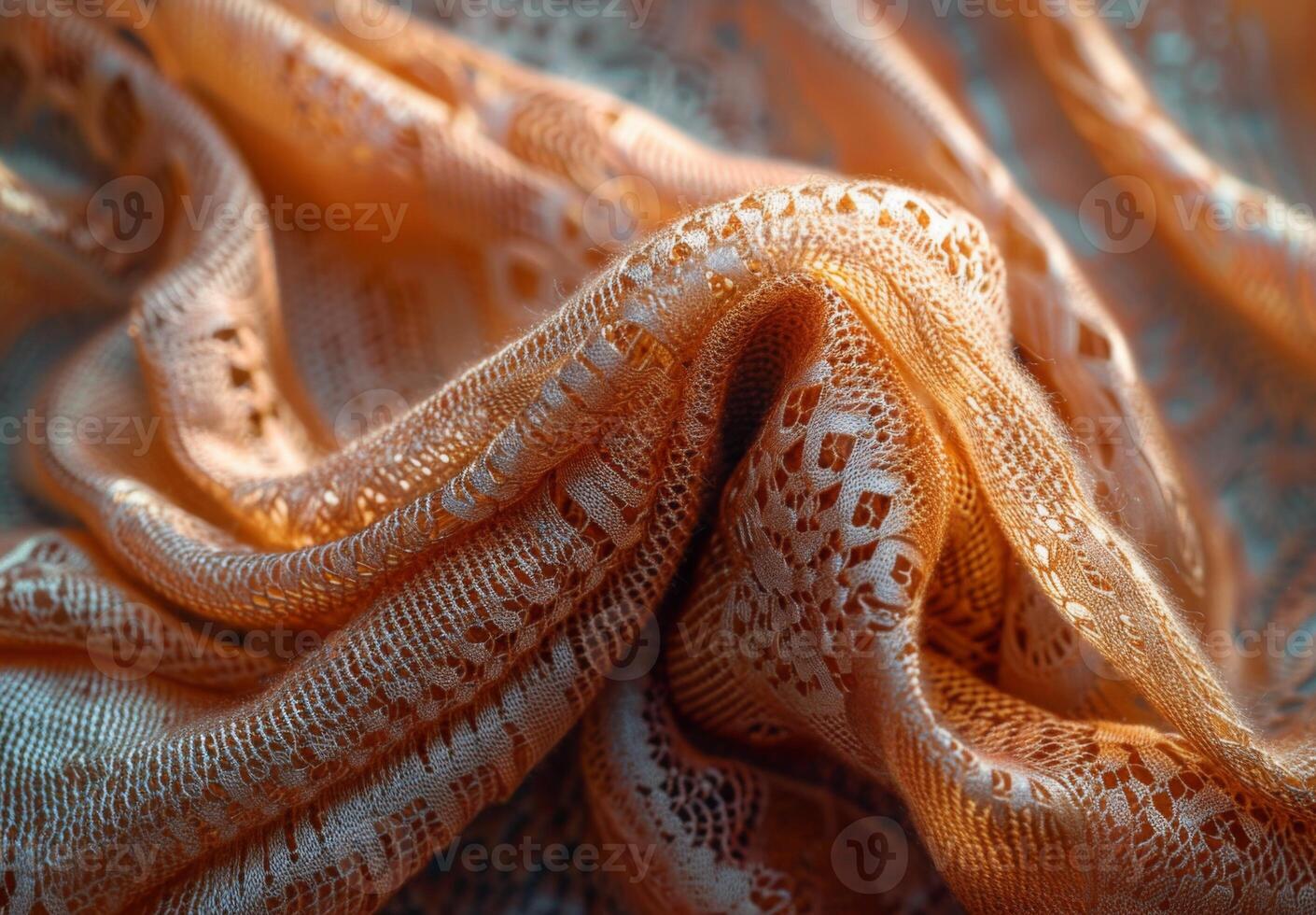 An orange lace fabric with a pattern photo