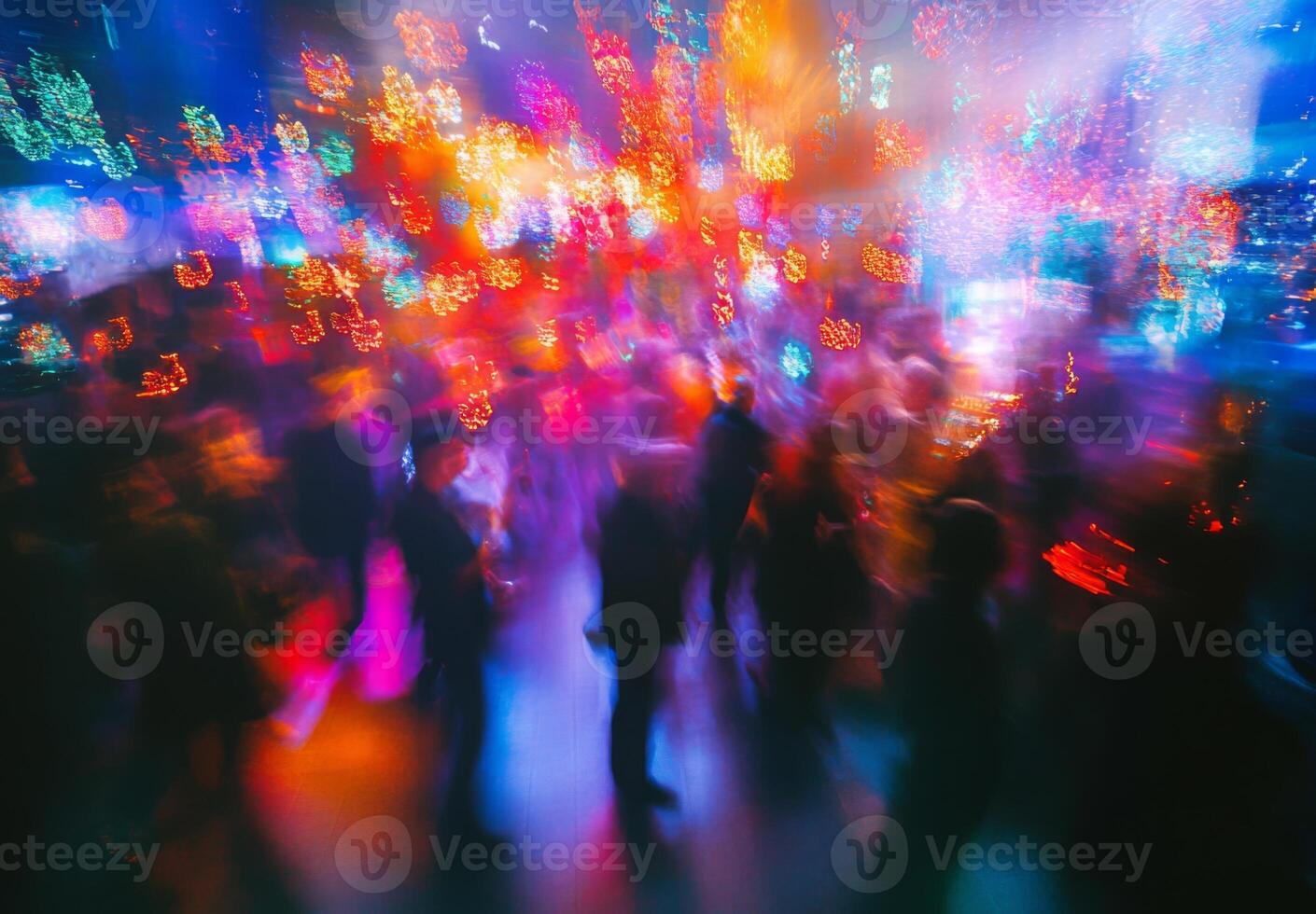 Blurred image of people dancing at a party photo