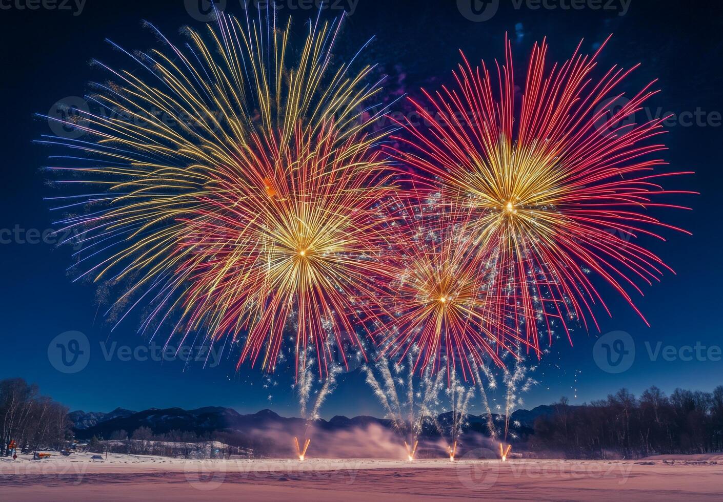 A vibrant fireworks display over a snowy landscape, creating contrast with the cold, dark surroundings photo
