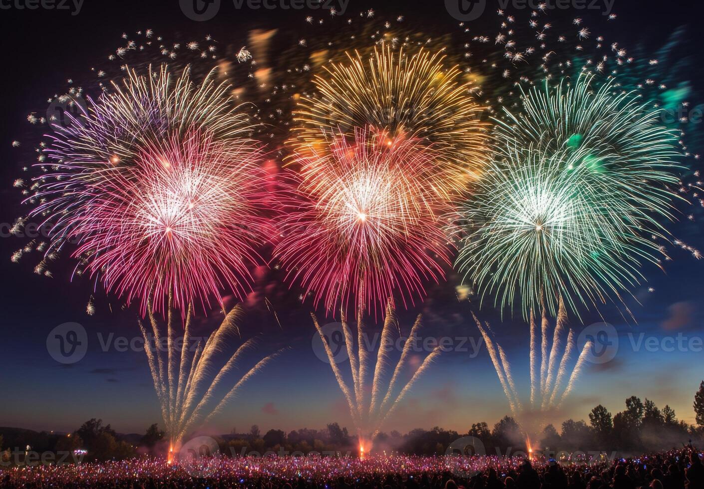 Colorful fireworks lighting up the sky with large bursts, silhouetting a cheering crowd below photo