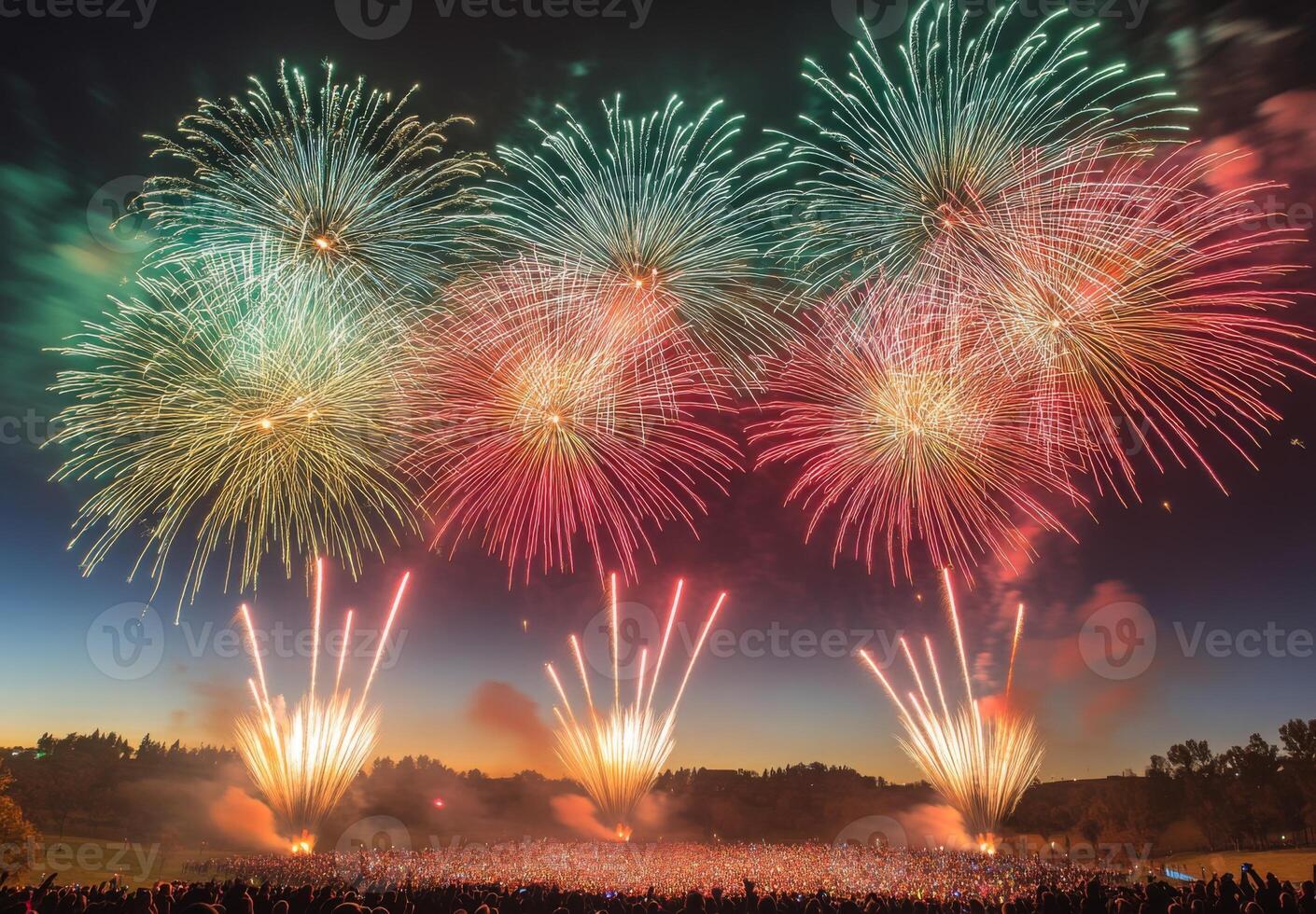 Colorful fireworks lighting up the sky with large bursts, silhouetting a cheering crowd below photo
