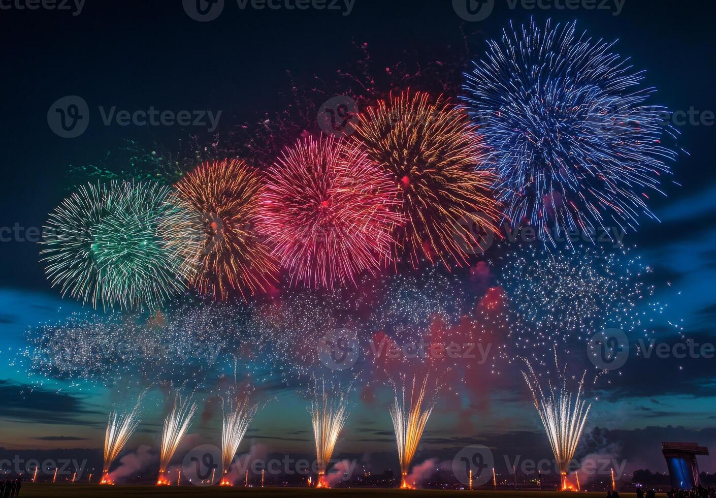 Multiple fireworks of different colors going off simultaneously, lighting up the night with vivid patterns photo