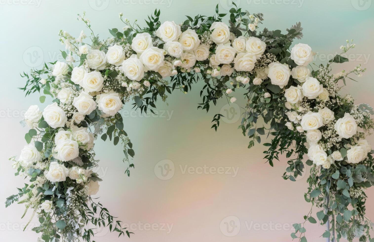 A white archway with white roses and eucalyptus photo