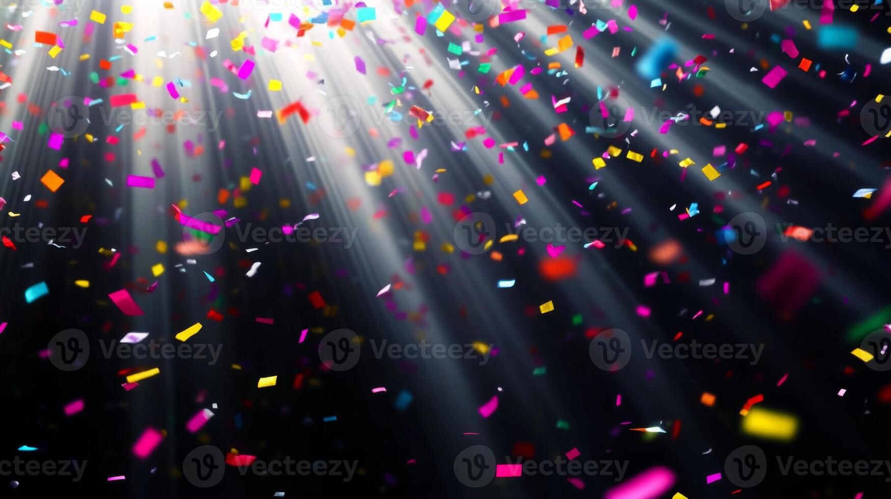 Bright, colorful confetti falling against a dark background, illuminated by sharp rays of light cutting through the scene, creating a festive and dynamic atmosphere photo
