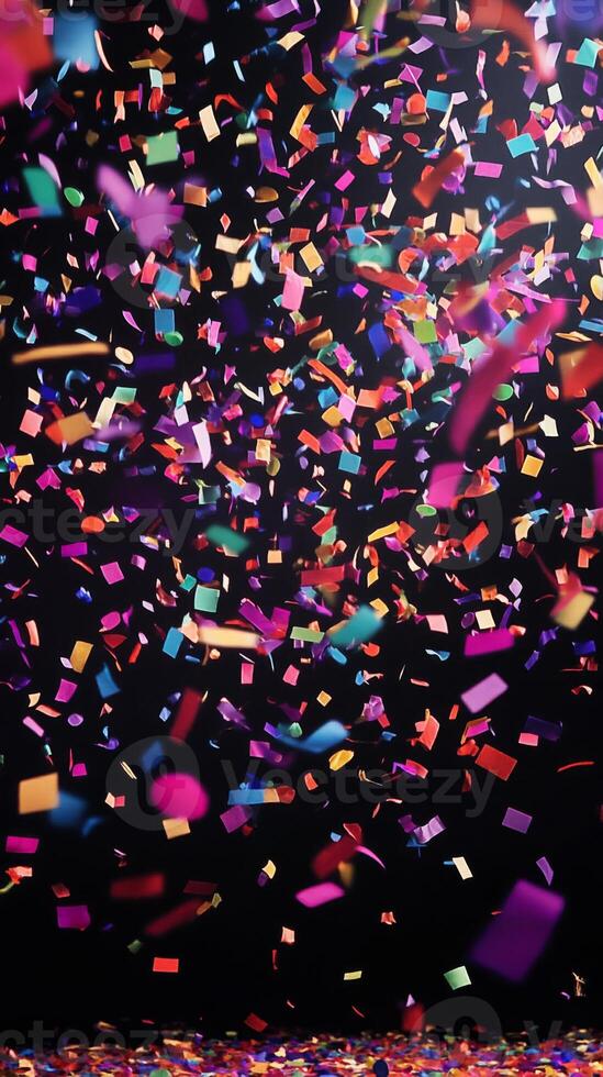 A vibrant scene of confetti fluttering through the air, with bold, colorful streaks of light illuminating the falling pieces against a deep black background photo