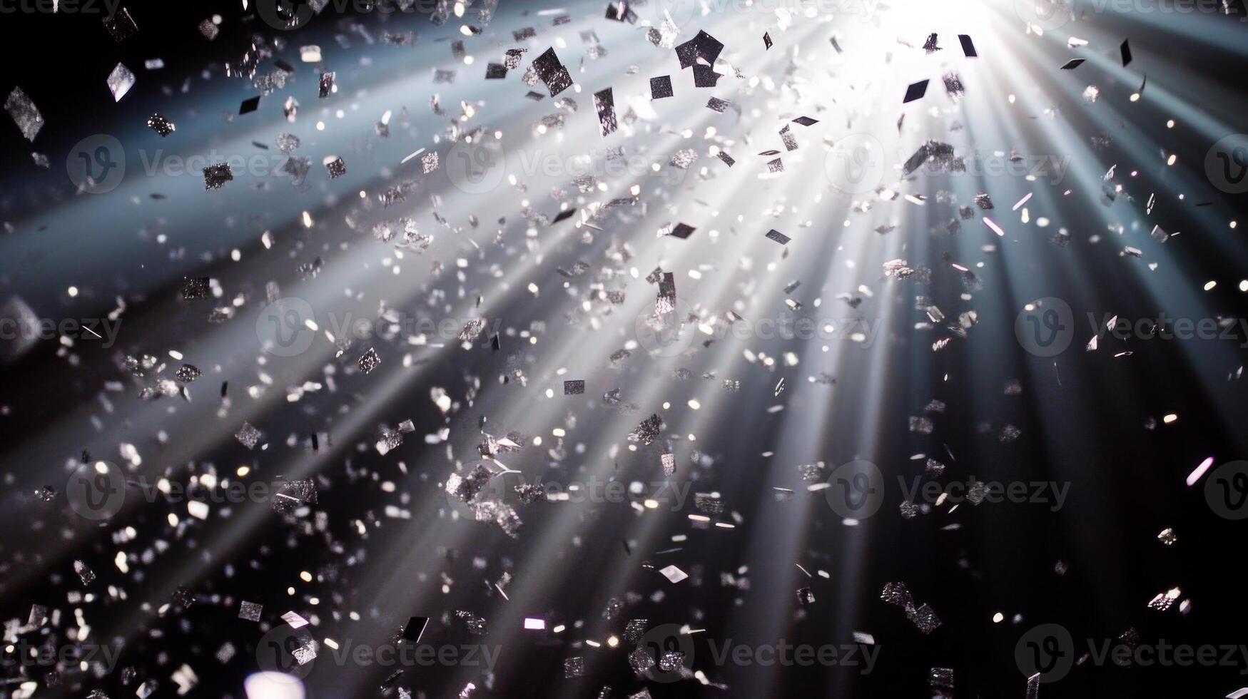 A cascade of metallic confetti falling in slow motion, with radiant beams of light piercing through the darkness, highlighting each piece in vivid detail photo