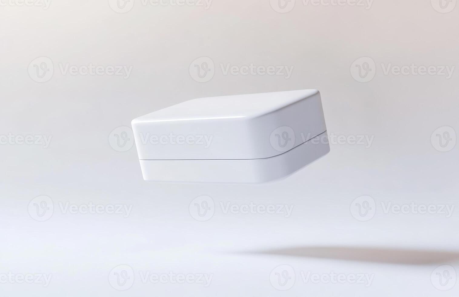 A simple, rectangular cosmetic jar hovering slightly above the surface, with subtle lighting and smooth edges, isolated on a white background photo