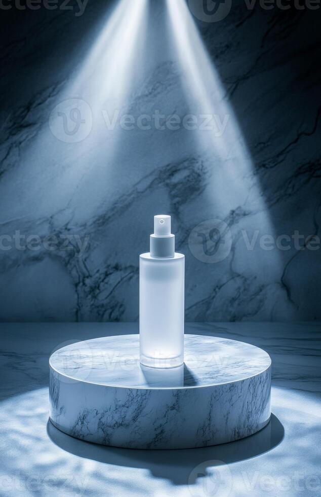 A bottle of perfume sits on a marble pedestal photo