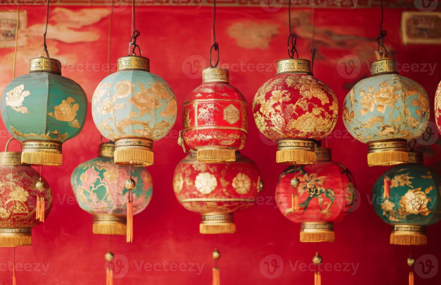 Many colorful chinese lanterns hanging from a wall photo