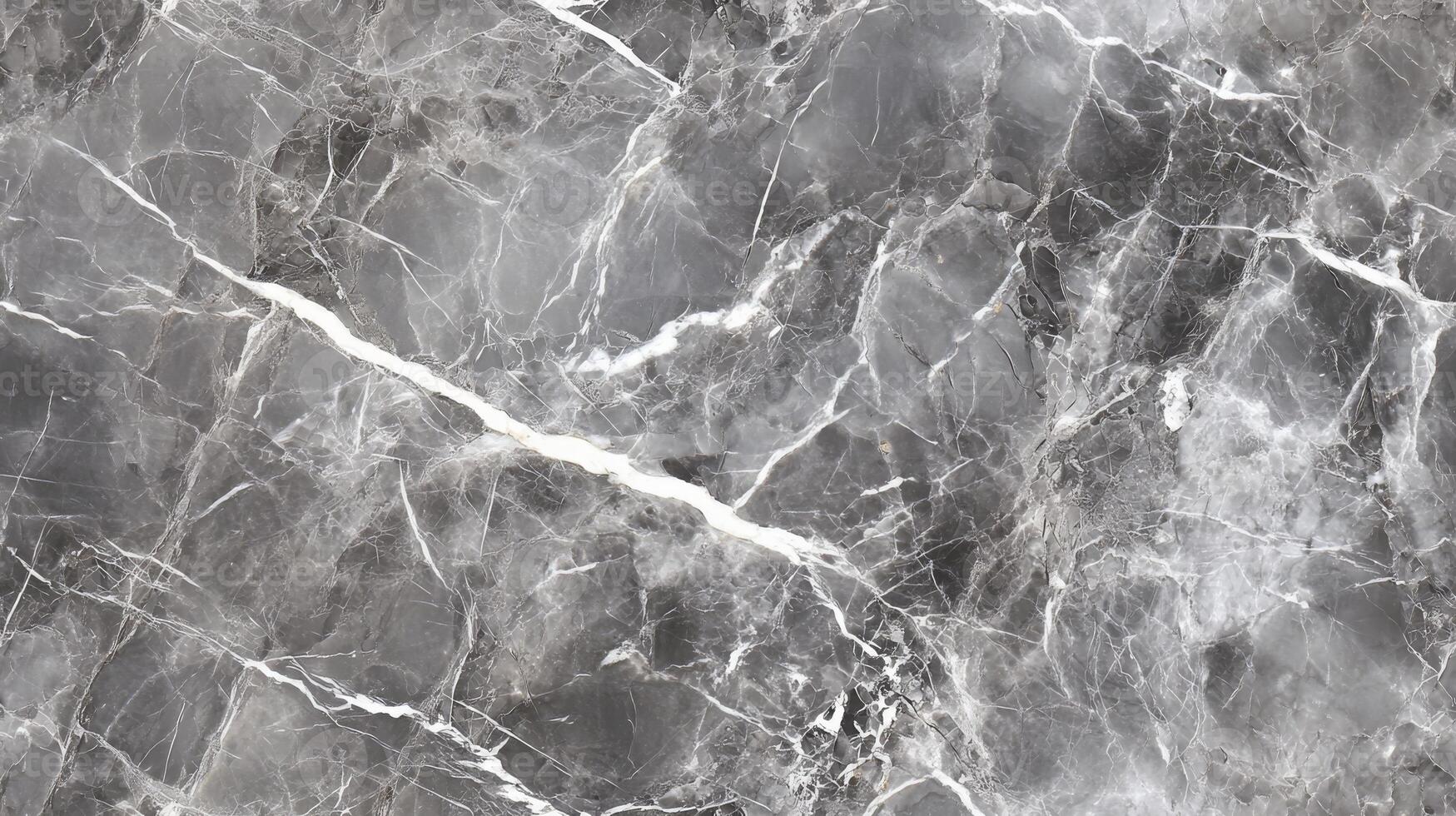 A close-up top view of polished grey marble with soft white veining, filling the frame with a sleek and contemporary texture photo