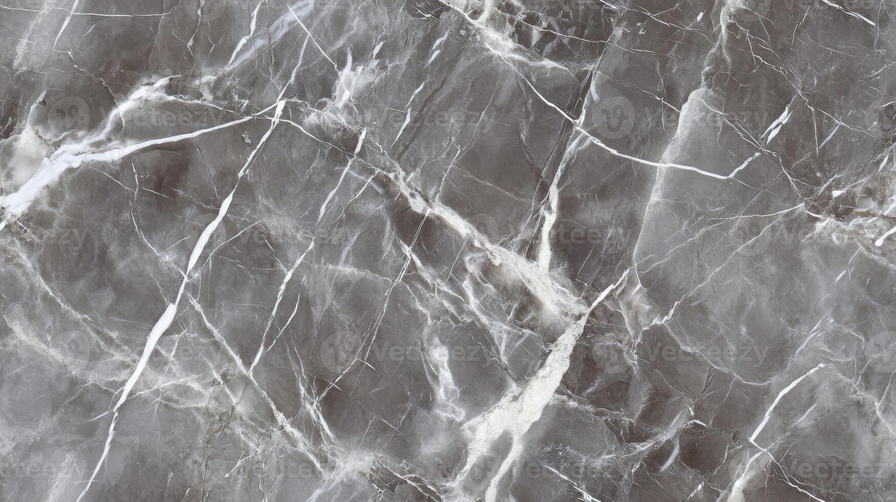 A close-up top view of polished grey marble with soft white veining, filling the frame with a sleek and contemporary texture photo