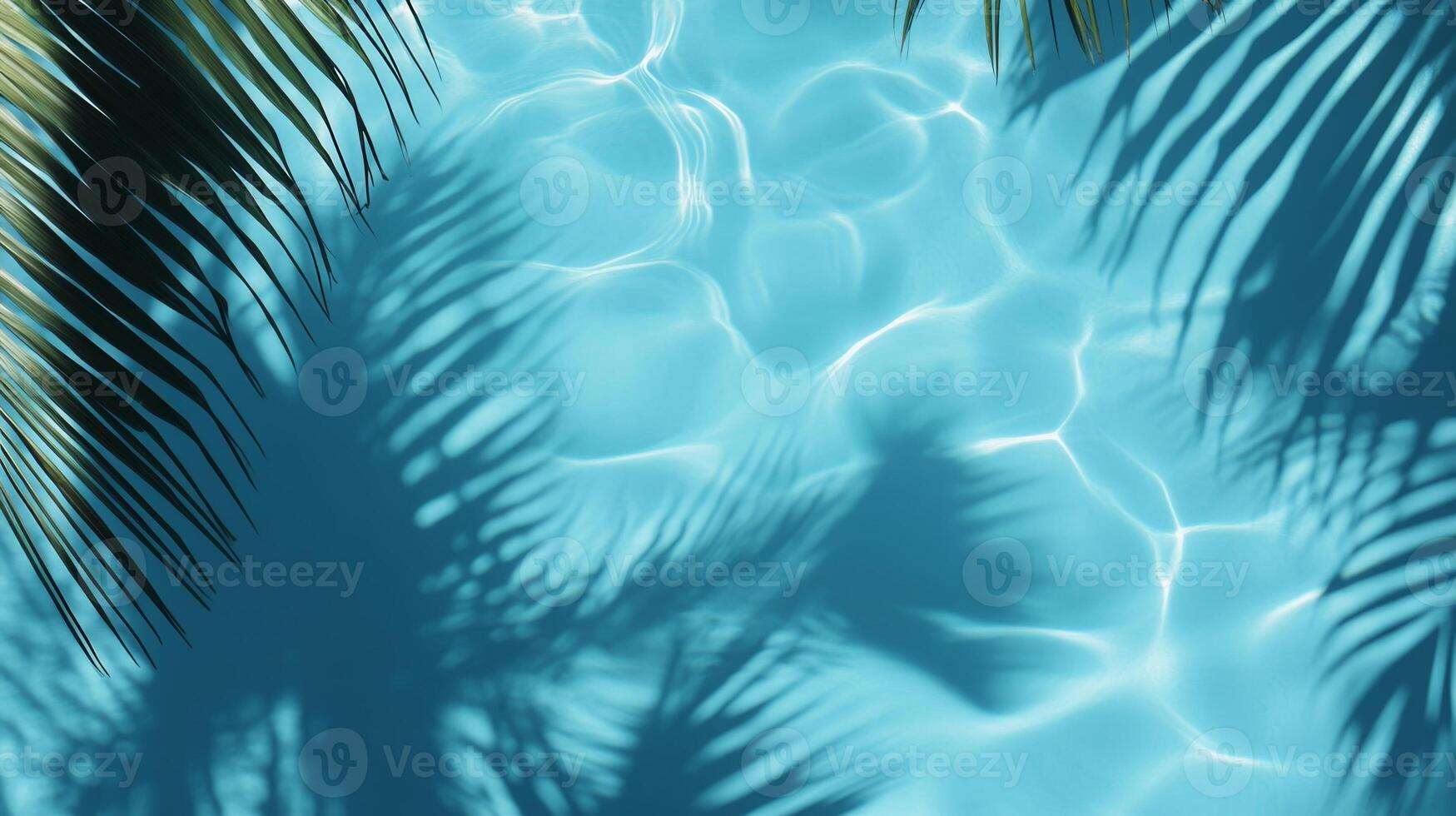 Bright blue pool water with soft ripples, highlighted by tropical leaves' shadows gently swaying on the surface photo