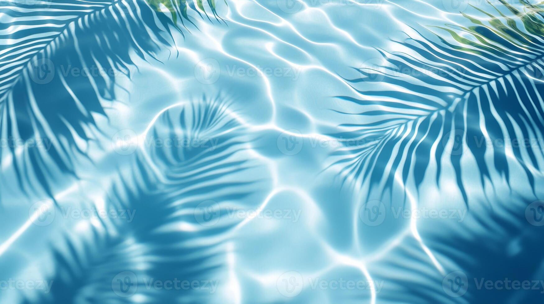 Dynamic water pool texture with soft wave ripples and overlapping tropical leaf shadows against a blue background photo