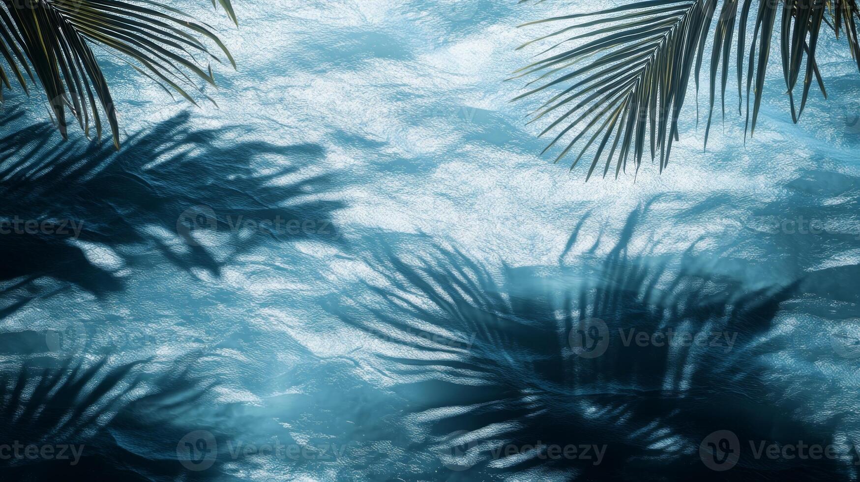 A dynamic water texture of blue waves, with sharp tropical leaf shadows enhancing the visual effect photo