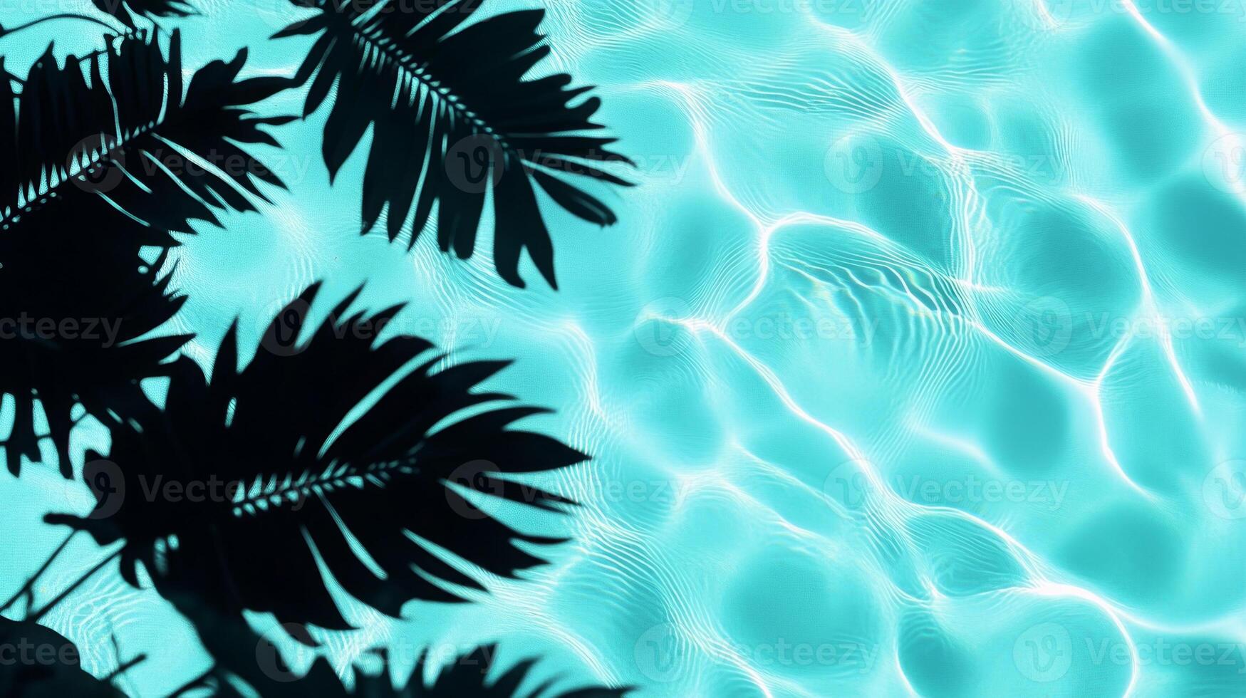 A playful combination of aqua waves and dark tropical leaf shadows contrasting against a light blue pool backdrop photo