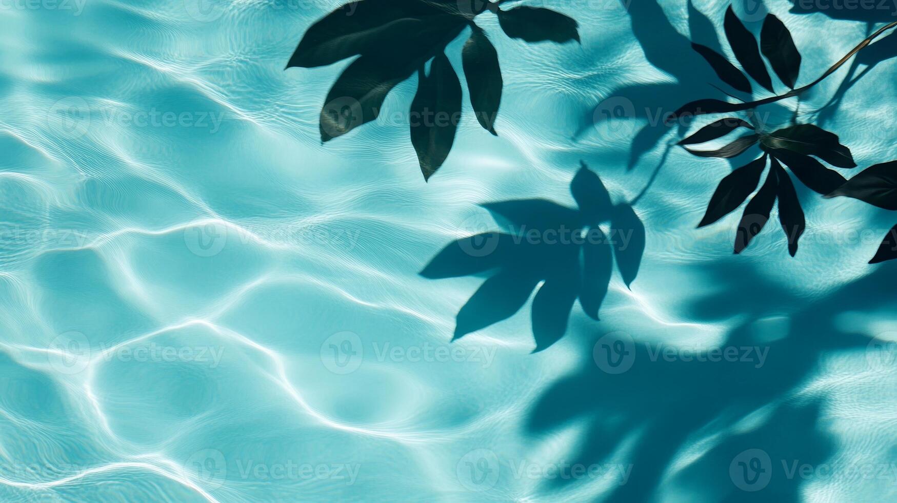 A playful combination of aqua waves and dark tropical leaf shadows contrasting against a light blue pool backdrop photo