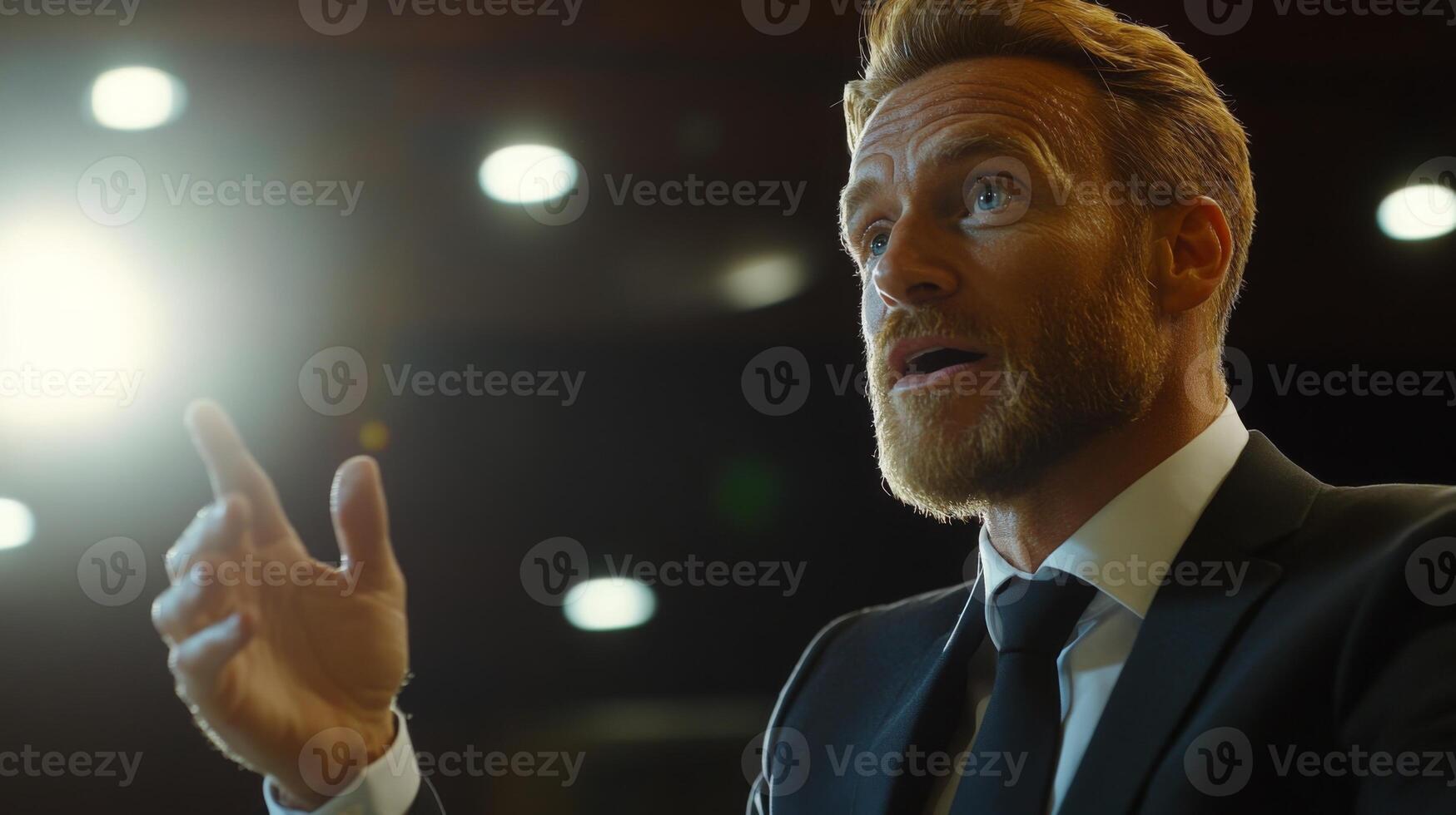 A corporate leader speaking at an annual meeting, gesturing confidently photo