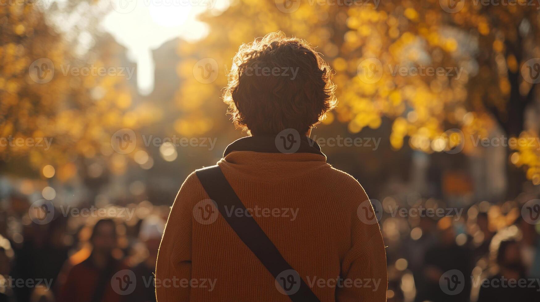 A person giving a speech in an outdoor setting, addressing a crowd at a rally photo